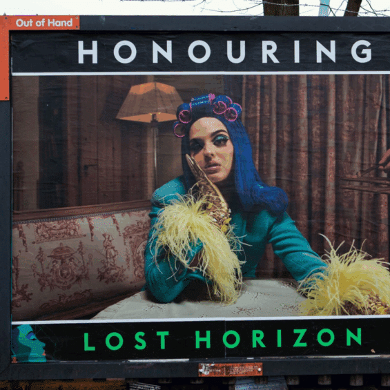 Photo of outdoor display ad with a press shot of Sita Bellan with the text 'Honouring, Lost Horizon' with the Lady of the House logo.